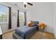 Bright bedroom with a ceiling fan and two windows at 4089 Thorndale Ln # 13, Smyrna, GA 30080