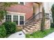 Welcoming front entrance with stone steps, iron railing, and lush landscaping leading to the front door at 4089 Thorndale Ln # 13, Smyrna, GA 30080