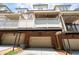 Townhome featuring multiple balconies with garages, offering stylish outdoor living and convenient parking at 4089 Thorndale Ln # 13, Smyrna, GA 30080