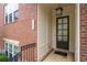 Inviting front entrance featuring a classic door, brick facade, and stylish welcome mat at 4089 Thorndale Ln # 13, Smyrna, GA 30080