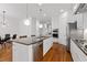 Contemporary kitchen with an island, granite counters, stainless steel appliances, and hardwood flooring at 4089 Thorndale Ln # 13, Smyrna, GA 30080