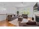 Open-concept living room with hardwood floors, fireplace, and ample seating, perfect for entertaining or relaxing at 4089 Thorndale Ln # 13, Smyrna, GA 30080