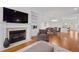 Elegant living room boasts a fireplace, built-in shelves, hardwood floors, and an open floor plan at 4089 Thorndale Ln # 13, Smyrna, GA 30080