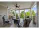 Covered patio featuring comfortable seating, a ceiling fan, and views of the community at 4089 Thorndale Ln # 13, Smyrna, GA 30080