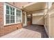 Cozy covered back patio space surrounded by a privacy fence and a brick home exterior at 4089 Thorndale Ln # 13, Smyrna, GA 30080