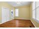 A bright bedroom with hardwood floors, double closets, and natural light streaming through the windows at 893 Piedmont Ne Ave # 5, Atlanta, GA 30309