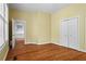 A well-lit bedroom featuring hardwood floors, double closets, and large windows at 893 Piedmont Ne Ave # 5, Atlanta, GA 30309