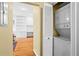 A view of the laundry room equipped with a stacked washer and dryer, adjacent to a doorway at 893 Piedmont Ne Ave # 5, Atlanta, GA 30309