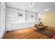 Well-lit living room with expansive built-in shelving, hardwood floors, and comfortable seating at 893 Piedmont Ne Ave # 5, Atlanta, GA 30309
