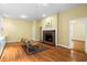 Cozy living room with a classic fireplace, gleaming hardwood floors, and ample natural light at 893 Piedmont Ne Ave # 5, Atlanta, GA 30309