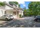 Exterior shot of a building with dedicated parking spaces and mature trees creating a serene atmosphere at 893 Piedmont Ne Ave # 5, Atlanta, GA 30309