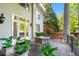 Covered patio features outdoor dining area, tile flooring, and elegant columns supporting the structure at 893 Piedmont Ne Ave # 5, Atlanta, GA 30309