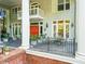 Charming porch with brick accents, black iron railings, and an inviting outdoor seating area at 893 Piedmont Ne Ave # 5, Atlanta, GA 30309