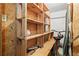 Functional storage with wood shelving, ideal for organizing tools and equipment, includes bike at 893 Piedmont Ne Ave # 5, Atlanta, GA 30309