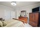 Bedroom with wood furniture, a dresser, and two closets at 115 Court Xing, Locust Grove, GA 30248
