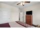Bedroom featuring a dresser with television and a view to another room at 115 Court Xing, Locust Grove, GA 30248