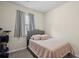 Cozy bedroom with a bed, a window, and a cat tree at 115 Court Xing, Locust Grove, GA 30248