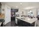 Open kitchen featuring granite countertops, stainless steel appliances, and a large kitchen island at 115 Court Xing, Locust Grove, GA 30248