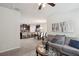 Open-concept living room flowing into the dining area and kitchen, perfect for entertaining at 115 Court Xing, Locust Grove, GA 30248