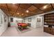 Spacious basement featuring a pool table and unique wood plank ceiling with recessed lighting at 1950 Wenlok Ne Trl, Marietta, GA 30066