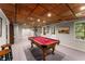 Finished basement with a pool table, recessed lighting, and access to the outdoors at 1950 Wenlok Ne Trl, Marietta, GA 30066