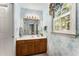 Bathroom with light blue walls and a large mirror above the vanity at 1950 Wenlok Ne Trl, Marietta, GA 30066