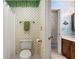 Bathroom with whimsical leaf print, shower curtain, and neutral walls at 1950 Wenlok Ne Trl, Marietta, GA 30066