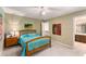 Bedroom with neutral walls, bright window, and access to an ensuite bathroom at 1950 Wenlok Ne Trl, Marietta, GA 30066