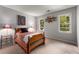 Cozy bedroom with neutral walls, carpeted floors, and two windows offering natural light at 1950 Wenlok Ne Trl, Marietta, GA 30066