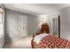 Bedroom featuring neutral walls, carpeted floors, and white door with access to other rooms at 1950 Wenlok Ne Trl, Marietta, GA 30066