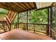 Spacious wooden deck offers outdoor living space with stairs leading to the yard, perfect for entertaining at 1950 Wenlok Ne Trl, Marietta, GA 30066