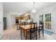 Bright dining area with backyard access and views of the kitchen area at 1950 Wenlok Ne Trl, Marietta, GA 30066