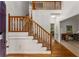 Inviting foyer with hardwood floors, staircase with wooden banister, and views into other rooms at 1950 Wenlok Ne Trl, Marietta, GA 30066