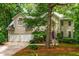 Beautiful home with a two-car garage, stucco exterior, and well-maintained landscaping at 1950 Wenlok Ne Trl, Marietta, GA 30066