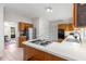 Kitchen featuring wooden cabinets, white counters, and stainless steel appliances at 1950 Wenlok Ne Trl, Marietta, GA 30066