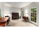 Bright living room with carpet floors, large windows, and ample space for furniture at 1950 Wenlok Ne Trl, Marietta, GA 30066