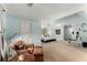 Large main bedroom with comfortable seating, a ceiling fan and a personal exercise machine at 1950 Wenlok Ne Trl, Marietta, GA 30066
