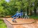 Community playground with slides, swings, and benches, is a fun and safe space for children to play at 1950 Wenlok Ne Trl, Marietta, GA 30066