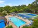 Community pool with tennis courts, lounge chairs, and picnic tables offers a resort-like experience for residents at 1950 Wenlok Ne Trl, Marietta, GA 30066