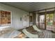 Relaxing screened porch with outdoor seating, wooden floors, and an inviting, sunny atmosphere at 1950 Wenlok Ne Trl, Marietta, GA 30066
