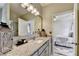 Granite countertops, framed mirror, and a view into the bedroom make this bathroom appealing at 2220 Lily Valley Dr, Lawrenceville, GA 30045