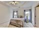 This bedroom is decorated with a comfortable bed, side table and stylish curtain at 2220 Lily Valley Dr, Lawrenceville, GA 30045