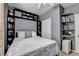 Well-lit bedroom features built-in shelving and storage with neutral paint and minimalist decor at 2220 Lily Valley Dr, Lawrenceville, GA 30045