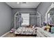 Bright bedroom showing a decorative bed frame, matched with a dresser and mirror set at 2220 Lily Valley Dr, Lawrenceville, GA 30045