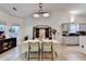 Bright dining room features an antique cabinet and seating for four at 2220 Lily Valley Dr, Lawrenceville, GA 30045