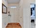Bright entryway with hardwood floors, white walls, and a view into a bedroom creating an open, welcoming feel at 2220 Lily Valley Dr, Lawrenceville, GA 30045