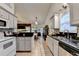 Updated kitchen featuring granite countertops, ample storage, and a view of the adjacent living area at 2220 Lily Valley Dr, Lawrenceville, GA 30045