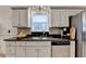 Kitchen with granite countertops, stainless steel appliances, and decorative tiled backsplash at 2220 Lily Valley Dr, Lawrenceville, GA 30045