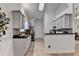 Well-lit kitchen with granite countertops, tile flooring, stainless steel appliances, and plenty of storage at 2220 Lily Valley Dr, Lawrenceville, GA 30045