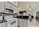 Open concept kitchen with stainless steel appliances, granite countertops, and an attached breakfast area at 2220 Lily Valley Dr, Lawrenceville, GA 30045